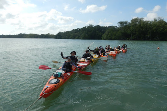 All smiles for the students kayaking in the hot sun during their sea expedition!