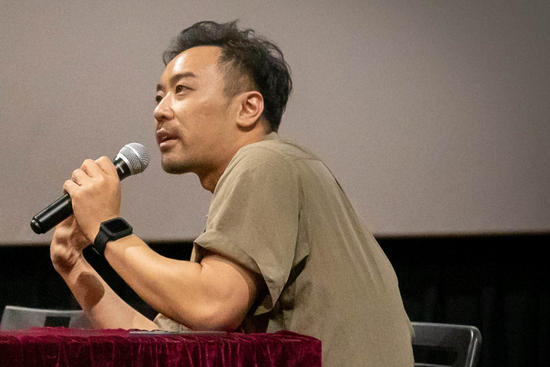 Director of the Movie Ajoomma, He Shuming, answering Q&A questions from the audience.
