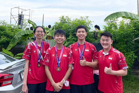 (left to right) SUSS AUG basketball players – Han Xingyue, Seet Zhi Yun and Teo Zhen Kai – together with Joshua Tay, team manager for AUG Wushu.