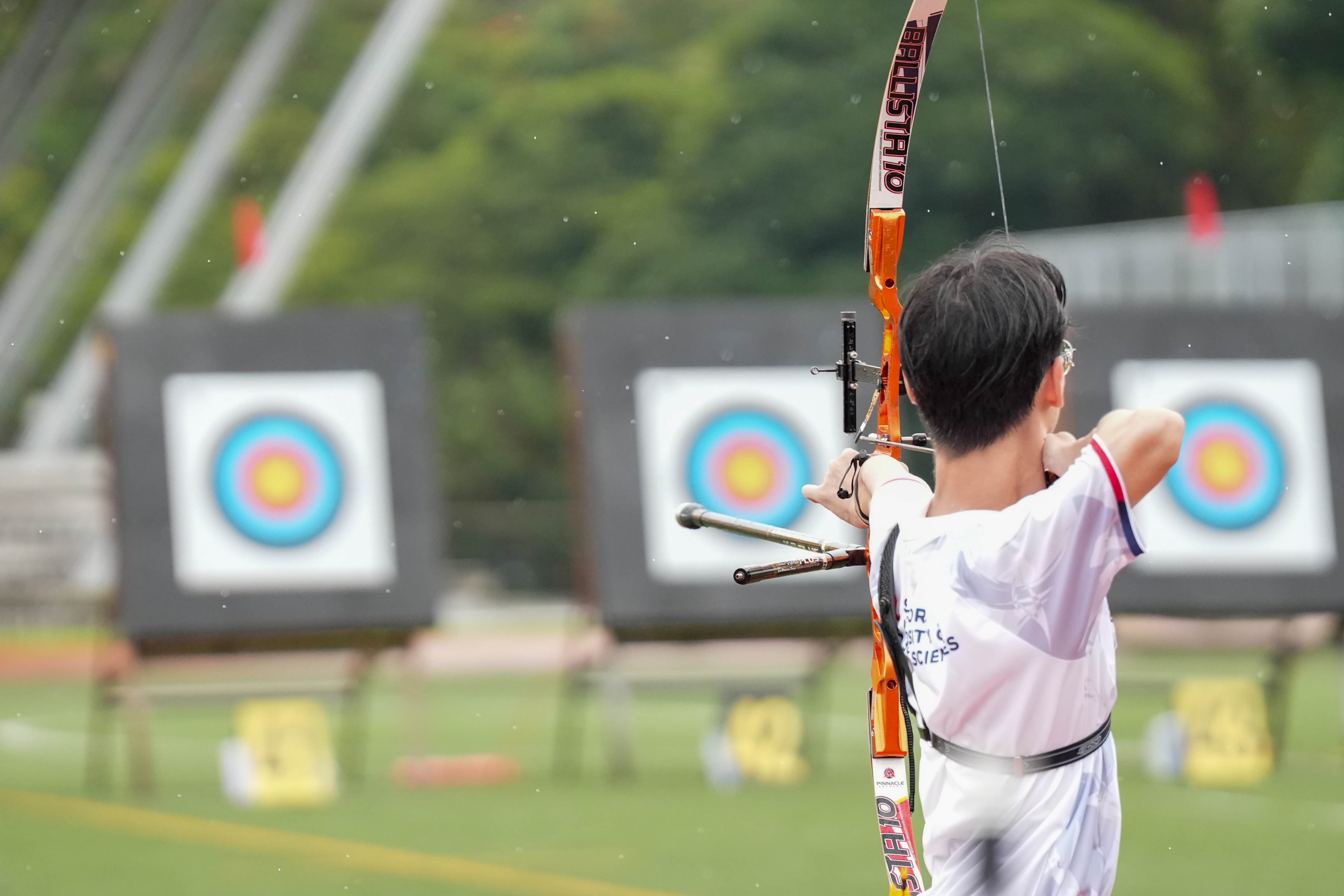 Tristen competing in the rain during his first archery competition.