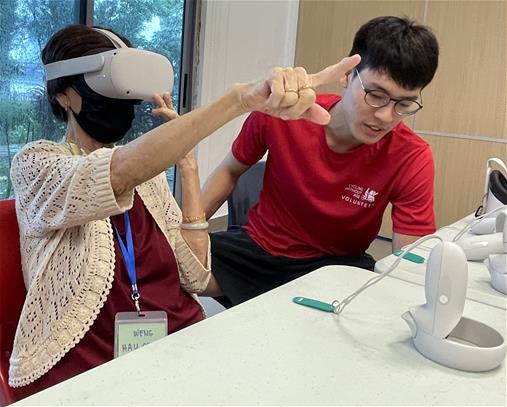 A senior immersing in the world of the VR trishaw ride.