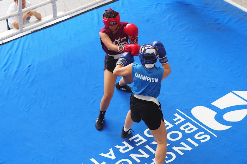 Ysabel from SUSS Boxing competing in the red corner during her match