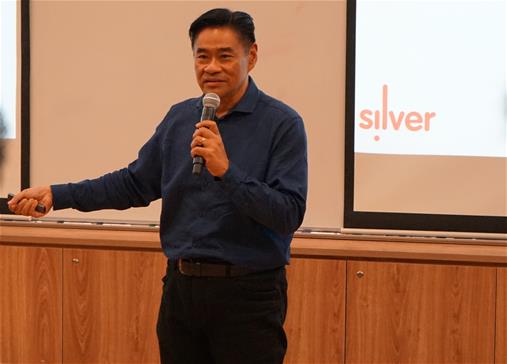 Jerome Yuen, CEO of Cycling Without Age, preparing seniors for their novel VR experience.