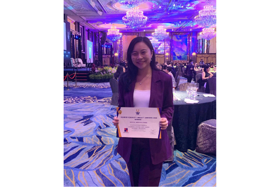 Laurene and her award at the Gender Equality Impact Award ceremony.