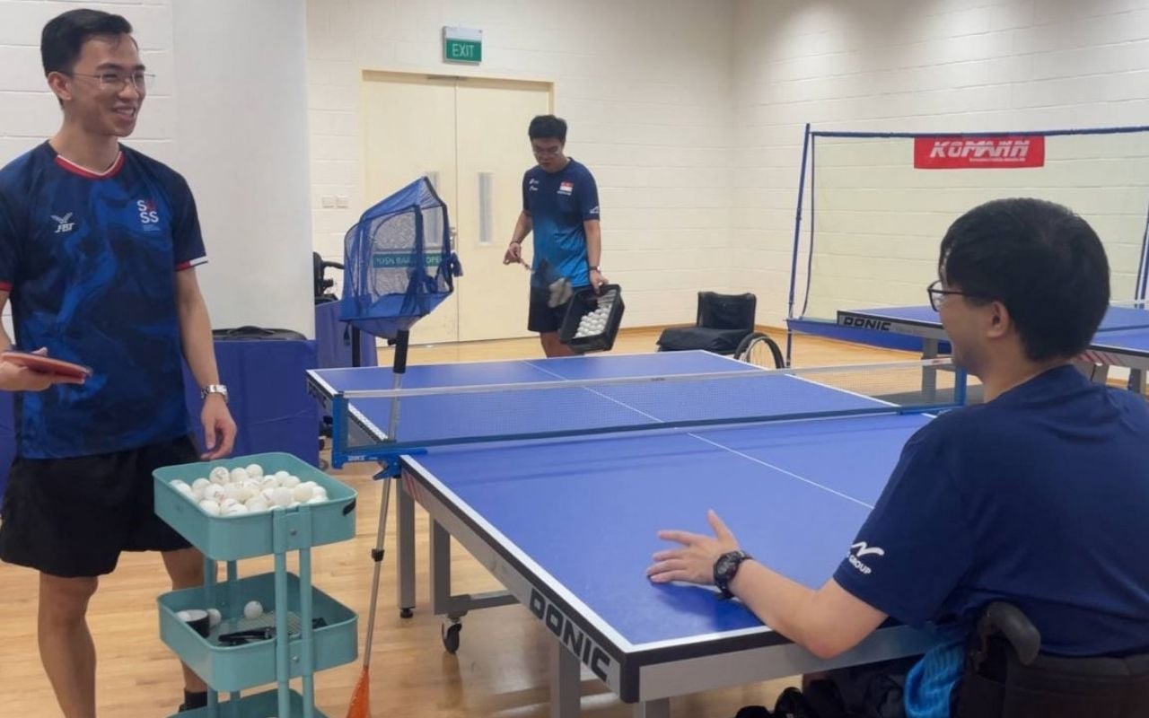 Student interacting with TTADS athlete between matches