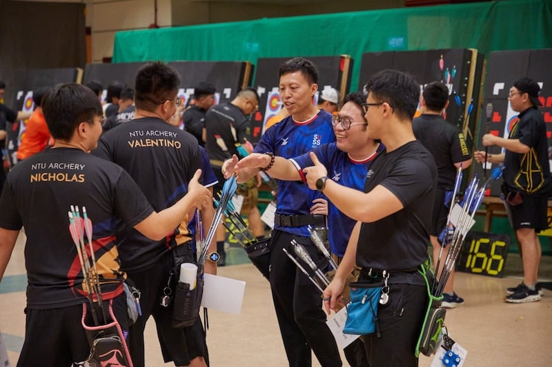 The SUSS Archers demonstrating sportsmanship and building friendships