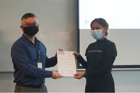 Professor Robbie Goh, SUSS Provost (left), presents the Certificate of Achievement to Marielyn Kamarudzaman, SUSS Marketing Student (right), who placed second overall. Professor Robbie Goh, SUSS Provost (left), presents the Certificate of Achievement to Marielyn Kamarudzaman, SUSS Marketing Student (right), who placed second overall.