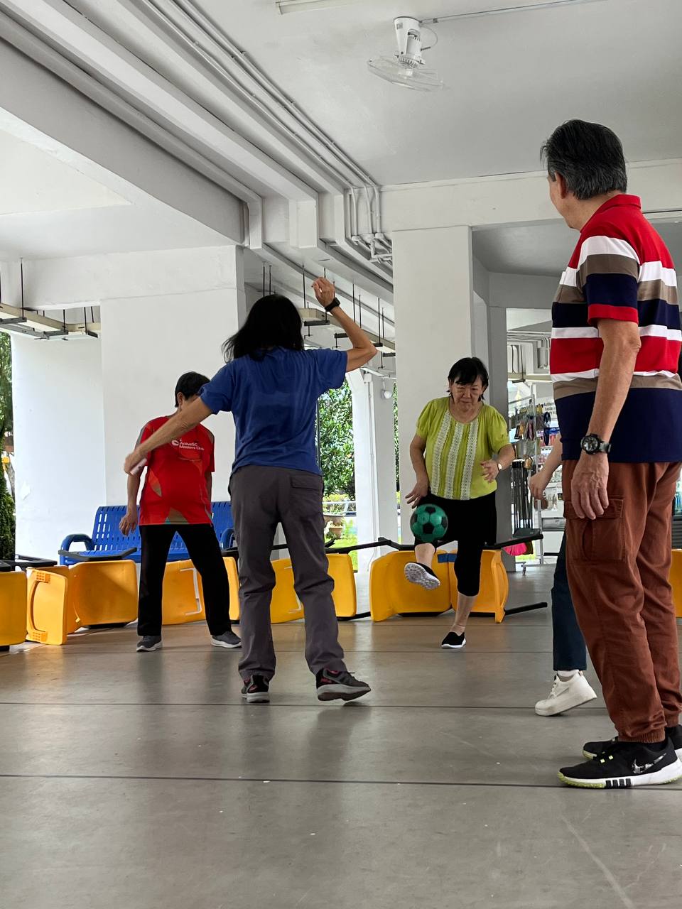 Void deck transformed into a human foosball arena for the seniors Void deck transformed into a human foosball arena for the seniors