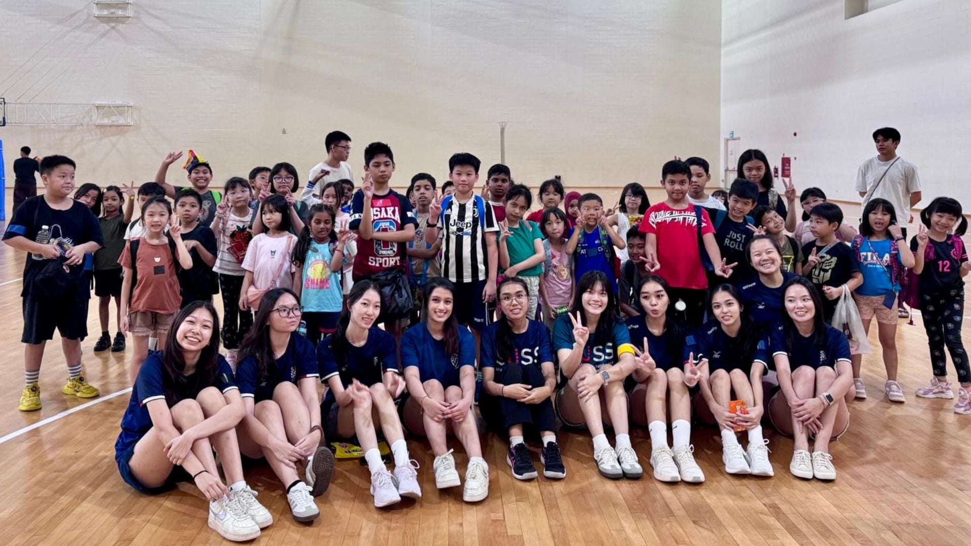 Smiles all around with the children at Suncare and SUSS Netball.