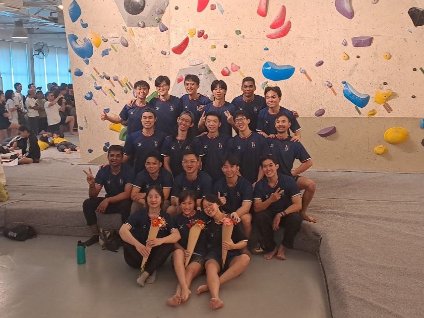 The 19 SUSS Outdoor Adventure Interest Group (ODAIG) representatives gathering for a group photo during the Inter-School Boulder League (ISBL) to mark the club’s largest turnout at a climbing competition.