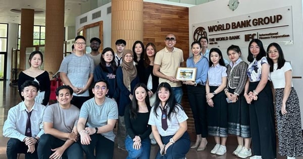 Students interacting with the human development team and the general manager of the World Bank Laos.