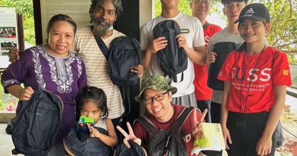The winning team celebrates with their prize, a bagpack!
