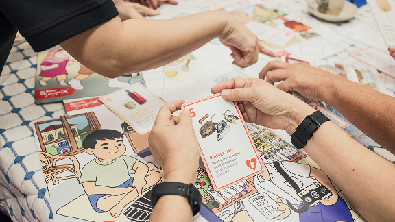A reminiscence facilitator engaging older adults during a session