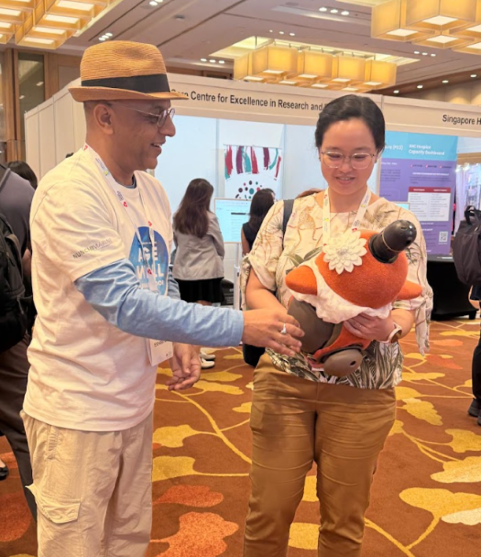 attendee-cuddling-lovot Attendee cuddling LOVOT
