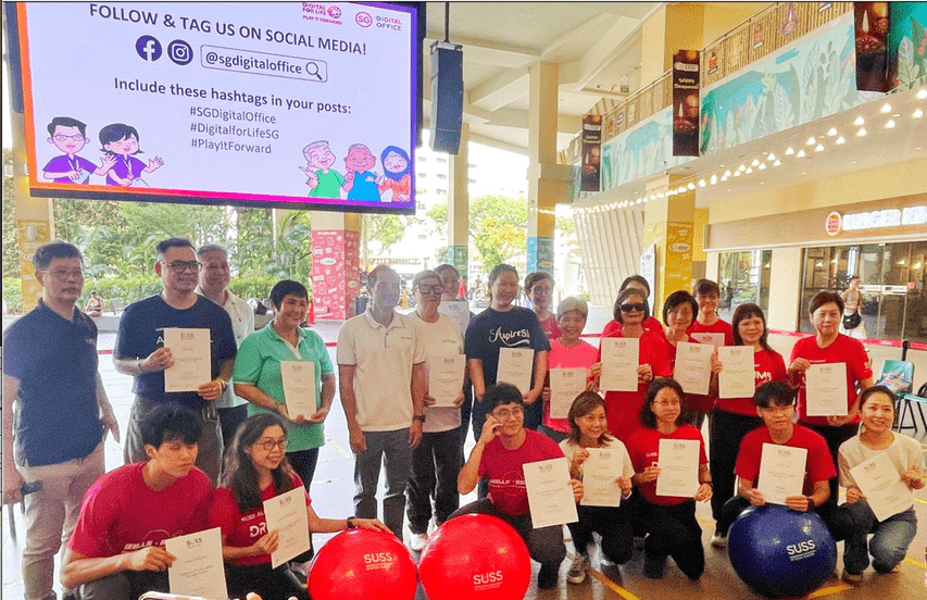 Event participants holding Drums Up for Active Ageing (Certified Trainer) course certificates in collaboration with SUSS-Nunchi Marine Age Well Programme and SUSS Unilearn
