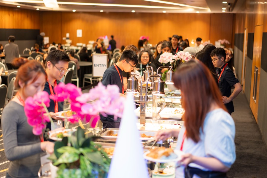 SUSS Career fair attendees networking and enjoying refreshments during the event