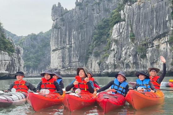 Kayaking at the UNESCO World Heritage site Ha Long Bay.