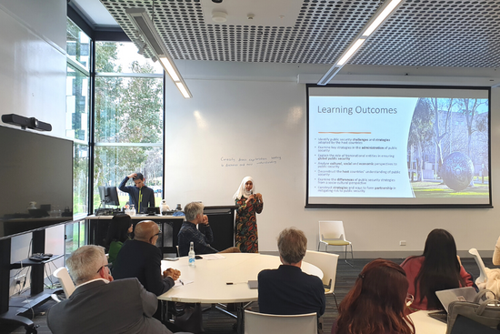 Associate Professor Razwana Begum presenting the learning outcomes of the OEL325 Public Security in Asia-Pacific to students and guests at the University of Canberra.